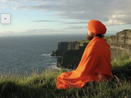 Dada Nabhaniilananda meditating beside the sea