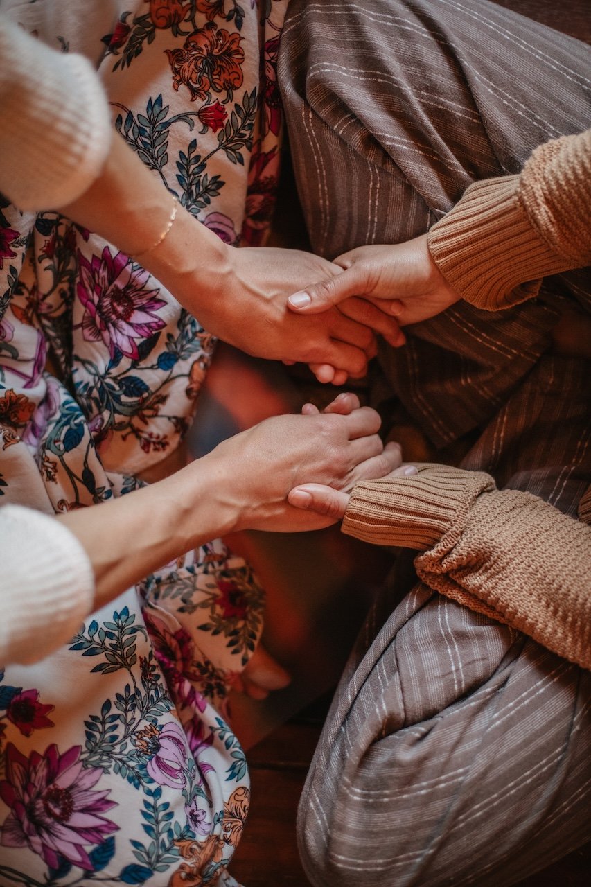 Hands meeting in a circle
