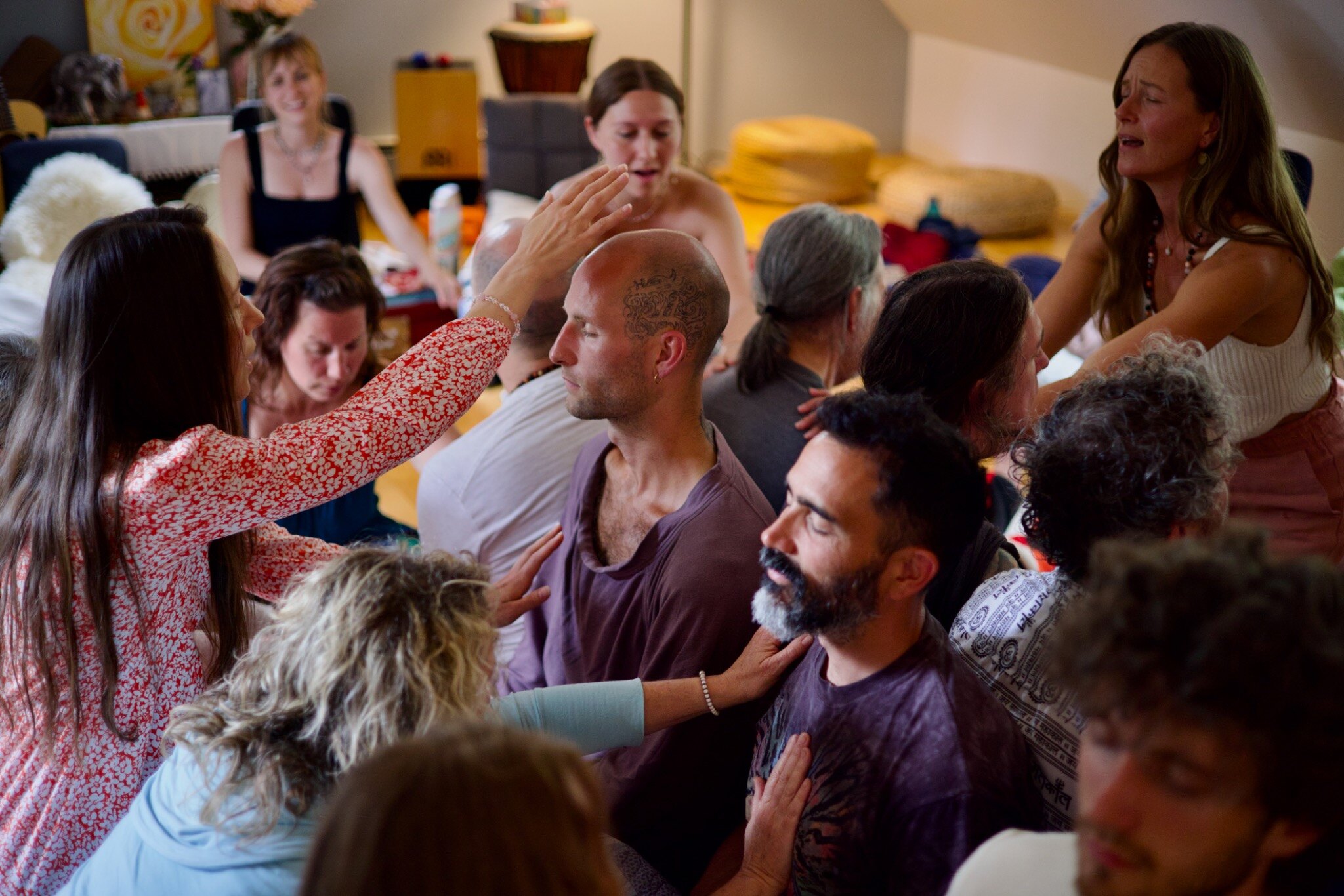 A Voices of Alchemy circle offering voice, touch, and presence