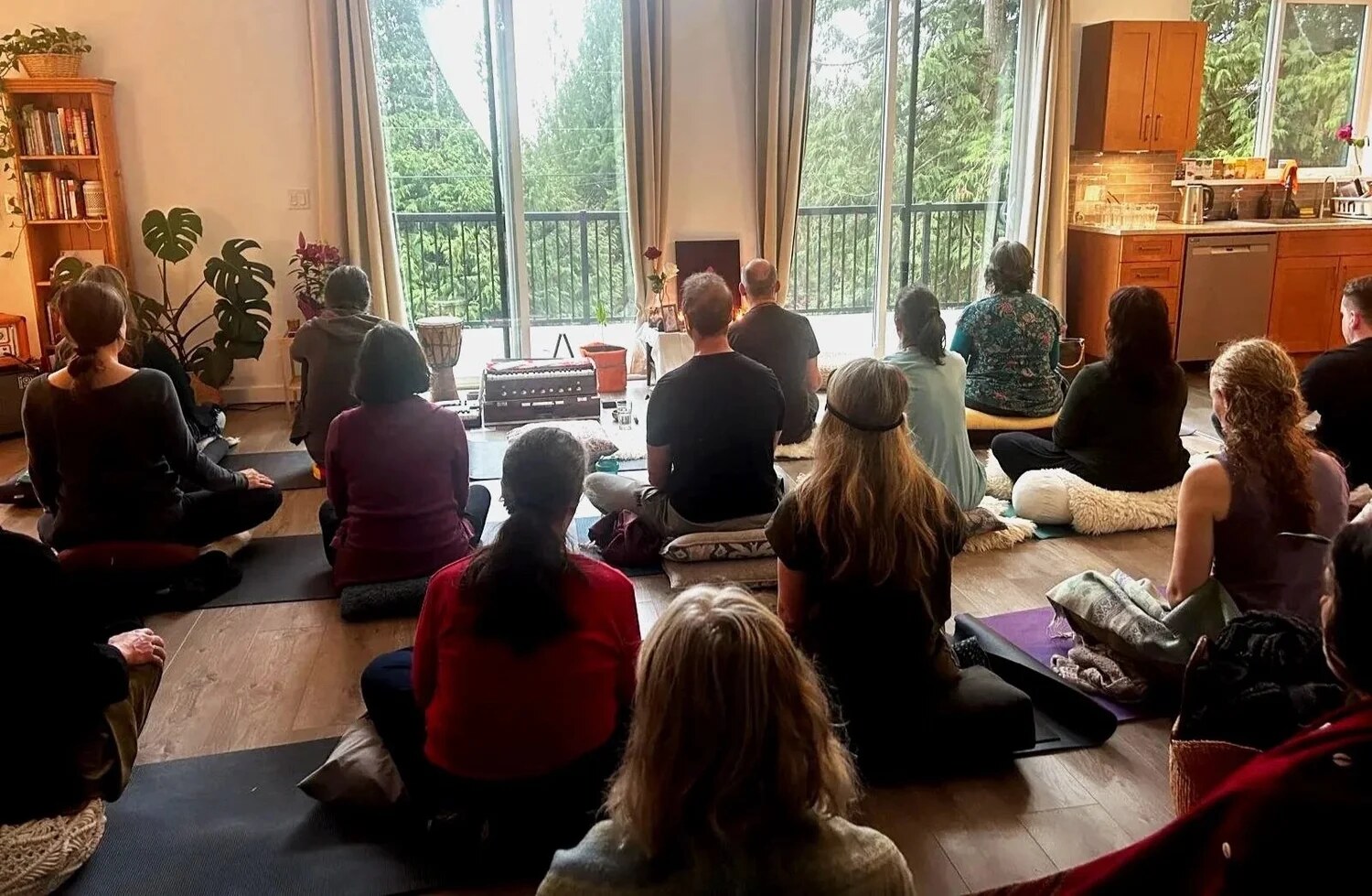 The Heartfield community seated together in meditation